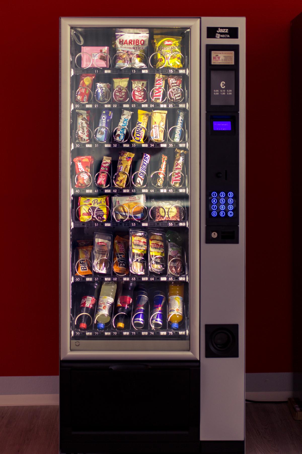 Image of a vending machine with various snacks and drinks, showcasing the convenience and variety of products available.